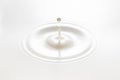 Drop created splash with circle ripple Royalty Free Stock Photo