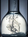 Chemical Reaction - Ink Diffusing in a Glass Flask Royalty Free Stock Photo