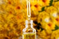 Drop falling from dropper of essential oil, aromatherapy essence, or medicinal liquid