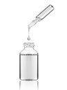 Drop falls from a cosmetic or medical ampoule into a bottle Royalty Free Stock Photo