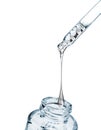 Drop falls from a pipette into a cosmetic bottle close-up Royalty Free Stock Photo