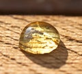 A drop of honey on the surface of the plank