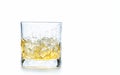 Drop ice cubes in to whiskey in rock glass or Old Fashioned glass Royalty Free Stock Photo