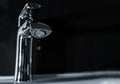 A drop of pure water dripping from the tap. Royalty Free Stock Photo