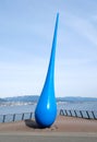 Spring Drop sculpture winter time in Waterfront, Vancouver BC view on the snowy sidewalk and mountains with North