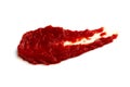 A drop of smeared red tomato paste isolated on a white background. Royalty Free Stock Photo