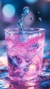 A drop of water dissolves into pink-colored water, creating blurred gradients and a smooth transition in this vibrant Royalty Free Stock Photo