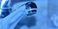 Drop of water falling from a faucet Royalty Free Stock Photo