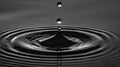 Drop of water falls into pool of water which is then reflected Royalty Free Stock Photo