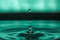 Drop of water splashing macro with ripples