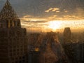 Drop of water on widow glass with light sunset in city and building view. Rainy season feeling alone. Work in city life concept Royalty Free Stock Photo