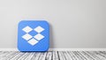 Dropbox App 3D Icon on Wooden Floor Against Wall