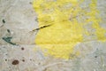 Protective canvas for house painter with big yellow paint