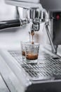 Droped expresso from machine Royalty Free Stock Photo