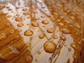 Droped water on varnished wood Royalty Free Stock Photo