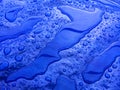 Droplets of rainwater on the blue tarp Royalty Free Stock Photo