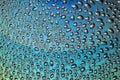 Droplets of Water over a Blueish Gradient Reflective Surface Royalty Free Stock Photo