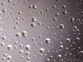 Droplets of water on a warm grey background Royalty Free Stock Photo