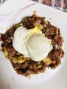 Dropped egg over corned beef hash.. Breakfast foods Royalty Free Stock Photo