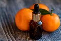 Dropper bottle of mandarin essential oil Royalty Free Stock Photo