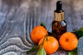 Dropper bottle of mandarin essential oil Royalty Free Stock Photo