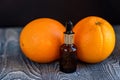 Dropper bottle of orange essential oil Royalty Free Stock Photo