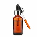 Dropper bottle with orange liquid isolated on white background Royalty Free Stock Photo