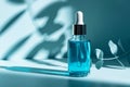 Dropper bottle of serum mockup on an abstract blue background with light and shadows
