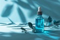 Dropper bottle of serum mockup on an abstract blue background with light and shadows