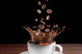 Dropping coffee beans on coffee cup