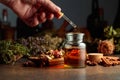 Dropping essential herbal tincture into a small glass bottle Royalty Free Stock Photo