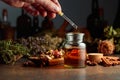 Dropping essential herbal tincture into a small glass bottle Royalty Free Stock Photo