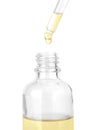 Dropping herbal essential oil into bottle Royalty Free Stock Photo