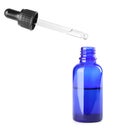 Dropping herbal essential oil into bottle isolated Royalty Free Stock Photo