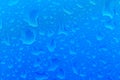 Drops on the car. Blue metal color car. Royalty Free Stock Photo