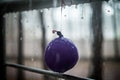 Drops on the child balloon and metal handrail, summer rain Royalty Free Stock Photo