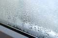 Drops of condensation on the glass of a metal-plastic window. Greenhouse effect