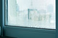 Drops of condensation on a metal-plastic window. Greenhouse effect