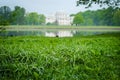 Drops of dew on grass and Yelagin palace in Kirov park Royalty Free Stock Photo