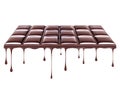 Drops dripping from melted chocolate bar on white background