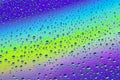 Drops on the glass against the background of the rainbow, texture and background Royalty Free Stock Photo