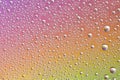 Drops on glass of different sizes and colors on a colored background, texture Royalty Free Stock Photo