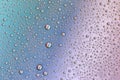 Drops on glass of different sizes and colors on a colored background, texture Royalty Free Stock Photo