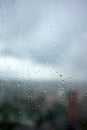 Drops on glass on rainy cloudy day evoke melancholy and sadness. View of city from the window. Selective focus Royalty Free Stock Photo