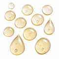 Drops of golden liquid with small bubbles inside Royalty Free Stock Photo