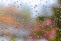 Drops Of Rain On Blue Glass Background. Street Bokeh Lights Out Of Focus. Royalty Free Stock Photo