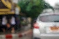 A drops of rain on the car glass blurred background in the raining and veiw look straight ahead on the road