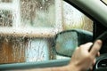 Drops of rain on the side window of the car, water falls from the driverÃ¢â¬â¢s window. Bad weather concept Royalty Free Stock Photo