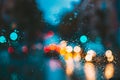 Drops Of Rain Water In Night Or Evening Street Lights On Blue Glass Background. Street Bokeh Lights Out Of Focus. Autumn Royalty Free Stock Photo