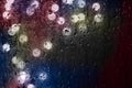 Drops Of Rain Water In Night Or Evening Street Lights On Glass Background. Street Bokeh Boke Lights Out Of Focus. Royalty Free Stock Photo